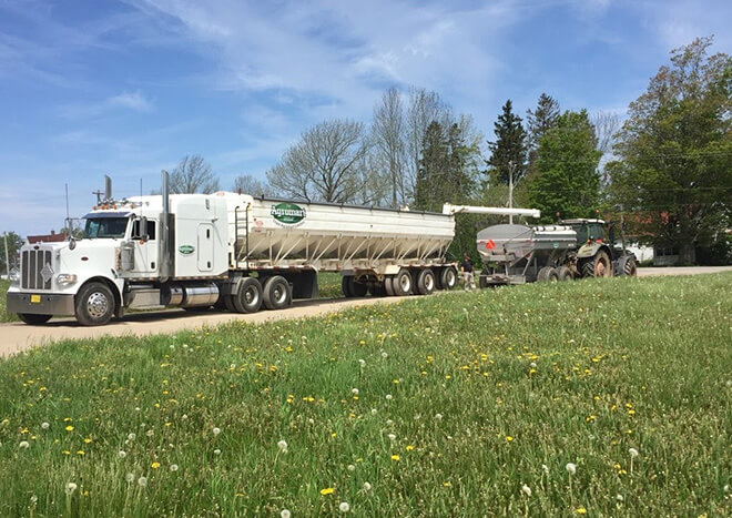 Truro Agromart services, Truro Agromart Truck transporting various goods on a beautiful day with blue skies