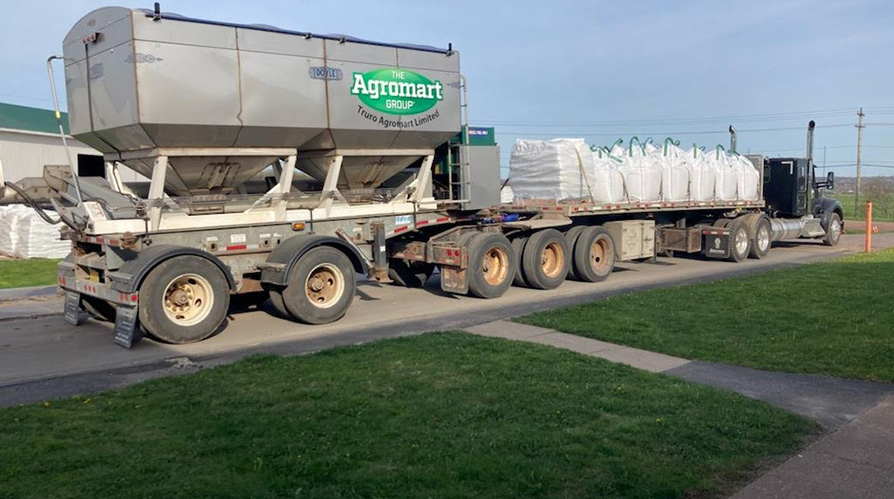 Truro Agromart Ltd. delivery truck, green patch and blue skies